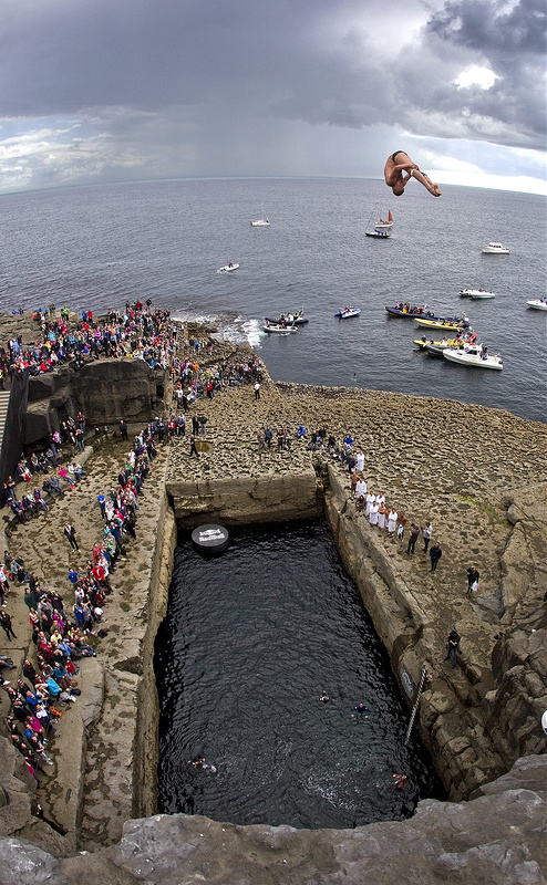 Artem Silchenko of Russia dives from the 28 metre platform during the fourth stop of the Red Bull Cliff Diving World Series, Inis Mor, Aran Islands, Ireland on August 4th 2012. // Romina Amato/Red Bull Content Pool // P-20120804-00063 // Usage for editorial use only // Please go to <a href="<a href=